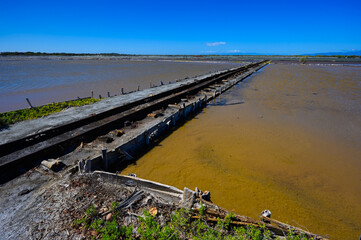Narrow gauge railway on lakes for salt mining in the south of the Dominican Republic. The photo....