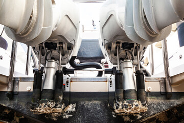 Lifting mechanisms on outboard motors at the stern of the boat. Transom lift on outboard motors of...