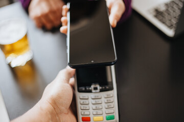 Woman paying using NFC technology