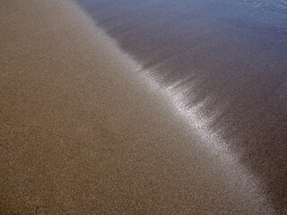 Wave of the sea on the sand beach