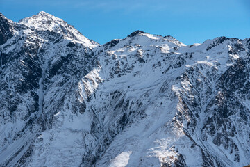Fototapeta premium Beautiful winter mountains landscape. High snow covered mountains. Georgia, Kazbegi.