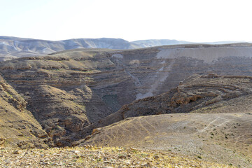 Mountain landscape, desert. Stony desert panoramic view. Unique relief geological erosion land form. Stone Desert on the West Bank. Judean Desert in clear weather. 