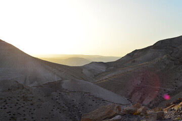 Mountain landscape, desert. Stony desert panoramic view. Unique relief geological erosion land form. Stone Desert on the West Bank. Judean Desert in clear weather. 