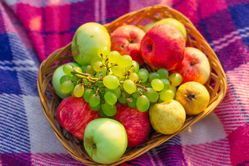 top view of fruit in basket. closeup of ripe fruits. apples, pea