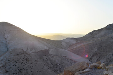 Fototapeta premium Mountain landscape, desert. Stony desert panoramic view. Unique relief geological erosion land form. Stone Desert on the West Bank. Judean Desert in clear weather. 