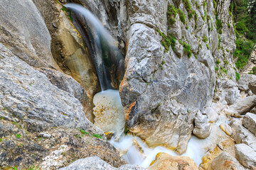 crystal clear water is falling down the Zgornji waterfall, Slovenia