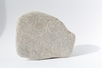Grey stones on a white background. Natural display with copy space