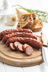 Smoked pork sausages. Sliced salami