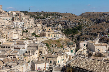 Obraz premium View of the Sassi di Matera a historic district in the city of Matera, well-known for their ancient cave dwellings. Basilicata. Italy
