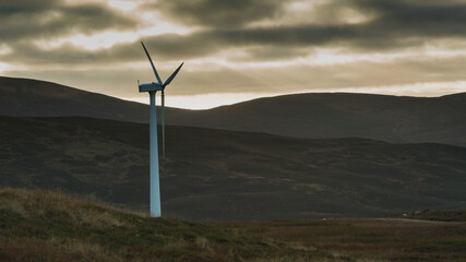 A lonely windmill standing in the mountains. © Jaroslaw