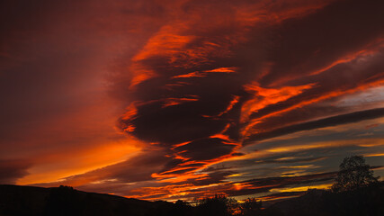 The colors of the setting sun create an interesting composition of clouds. © Jaroslaw