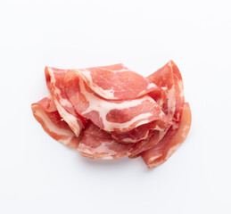 Italian prosciutto crudo or jamon. Raw ham. Isolated on white background.