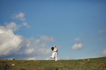 Adult couple walk in the mountains