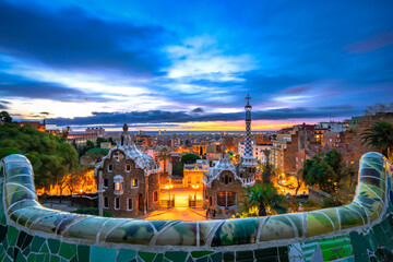 Obraz premium Skyline of Barcelona at dawn seen from Park Guell which was built in 1926