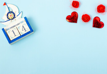 red hearts on a blue background with a place for the text, top view, Valentine's Day is the holiday of lovers.