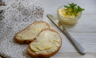 bread with butter on a wooden background