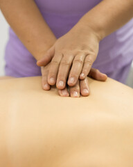 Indirect close-chest cardiac massage. Massager doctor hands closeup. Cosmetologist procedure acupressure.	