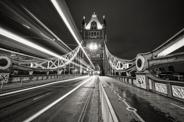 Tower Bridge with evening traffic lights in London. England 