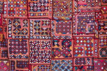 Detail old colorful patchwork carpet in India