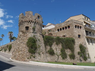 Fototapeta na wymiar Panorama of the Torricella of Termoli between the entrance arch into the old city through the city walls of the Swabian Castle and the The Folklore Staircase 