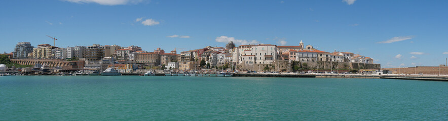 panorama from the port of Termoli on the old town enclosed by the walls of the Swabian Castle - obrazy, fototapety, plakaty