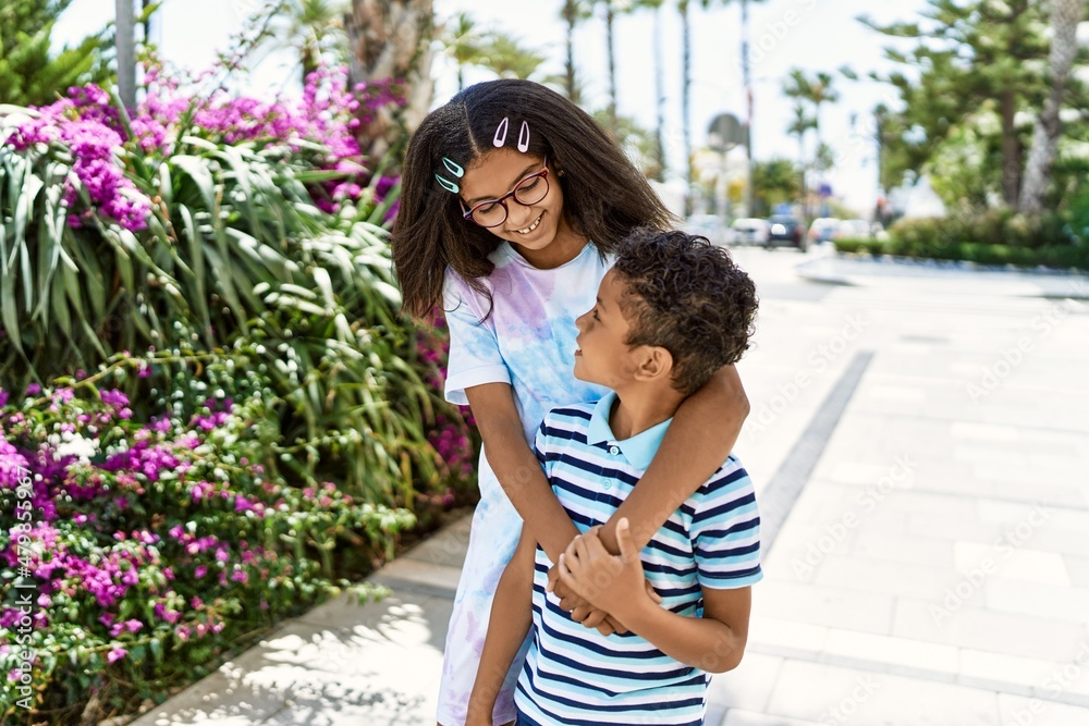 Canvas Prints African american brother and sister smiling happy outdoors. Black family of two siblings at the city on a sunny day.