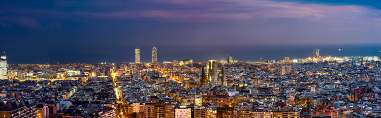 Fototapeta na wymiar Aerial rooftop panorama of Barcelona at dusk. Spain