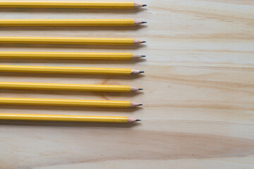 Fototapeta premium pencils on a wooden surface