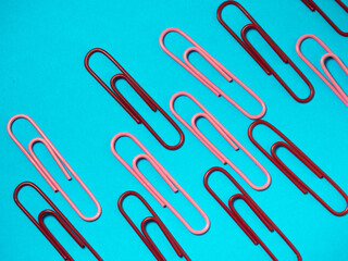 Office work. Colored paper clips. Colored paper with staples. Work with documents.