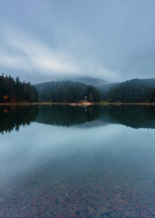 Synevyr lake on a foggy morning