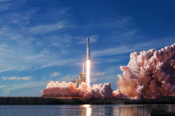 Take off space rocket on a background of blue sky and sun. Elements of this image were furnished by NASA