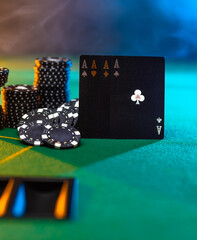 Playing cards, four aces and chips on a green gambling table. Casino, online casino, nightclub, money flow, risk, chance of luck. Poker, gambling, gambling business, advertising.