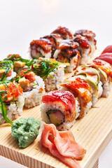  Wooden board of sushi isolated over white background