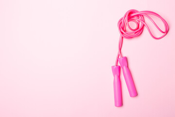 Skipping rope on pink background