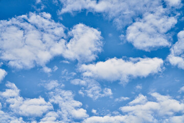 Naklejka na ściany i meble Beatiful blue sky with clouds on a sunny day