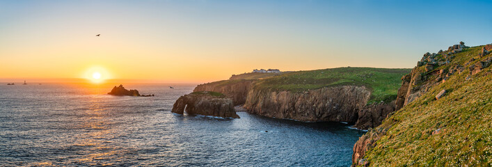 Land's End with Enys Dodman arch at sunset, Cornwall