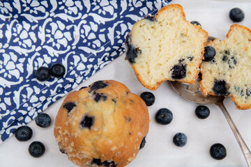 blueberry muffins with blue cloth 