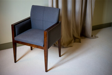 Wooden armchair in a modern apartment indoor