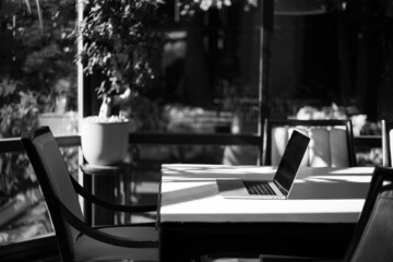 Laptop on the table in the interior of the apartment