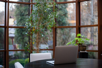 Working laptop in the interior of the apartment