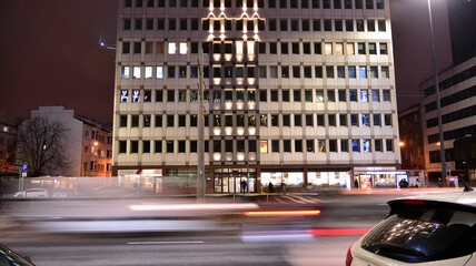 Cityscape in early night time with urban traffic. Street in the city in winter. Fast moving cars © Grand Warszawski