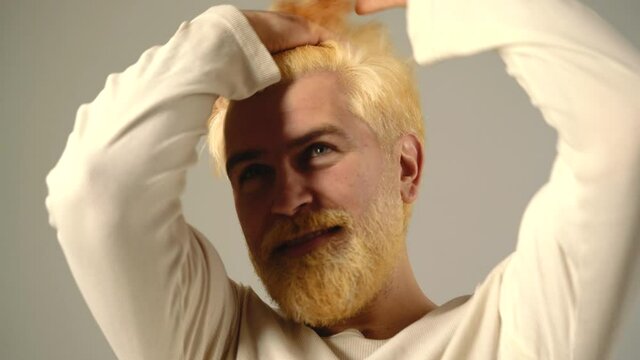Comic funny blonde berded man. Human emotions, hipster with funny face. Guy movement hair. Glad cheerful excited astonished funky scared surprised people.