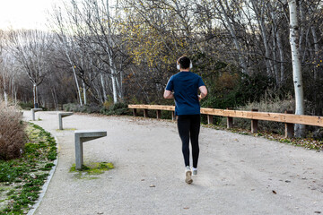 Young man jogging in park