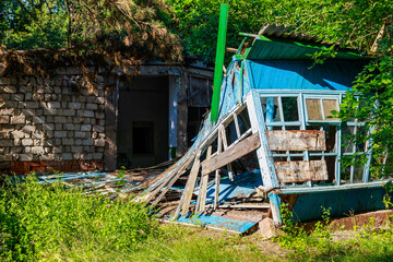 Ruined and abandoned rural house. The concept of a dying village and global urbanization....