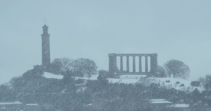 Edinburgh winter snowstorm in the city centre. Cityscape view of Calton Hill. Edinburgh, Scotland, United Kingdom