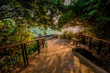 Panoramic nature background (mountains, sea, trees, twilight lights in the sky, waterfront communities), naturally blurred through the wind, seen on tourist spots or scenic spots