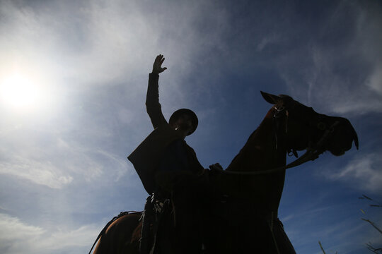 conde, bahia, brasil - january 8, 2022: Cowboy wearing traditional leather clothes with his horse on a farm in the city of Conde.