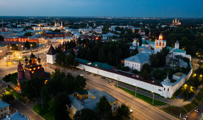 Cityscape of Yaroslavl with view of Transfiguration Monastery and Epiphany Church in evening.