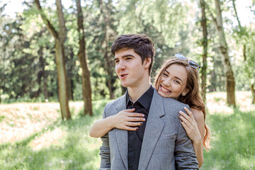 Young couple walking in a spring park on Valentine's Day. lifestyle happy family walking holding hands in the park