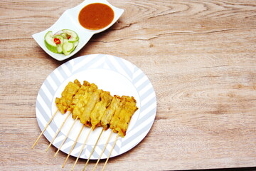 Pork satay,Grilled pork served with peanut sauce or sweet and sour sauce, Thai Street food.